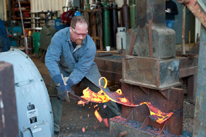 George Schroeder is hot-forging with his BIG hammer