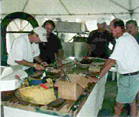 A group effort: Workshop attendees at EAA AirVenture Oshkosh 2002 making an oil tank for the Swallow. Some of these guys are skilled pros!